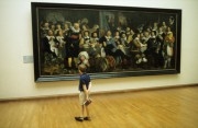 Boy looking at a painting