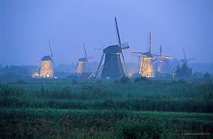 Netherlands, Kinderdijk . Sunset at Kinderdijk. This unique place is famous for its numerous windmills.